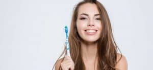 brushing teeth as part of teeth whitening aftercare