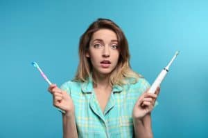 Lady with toothbrushes 