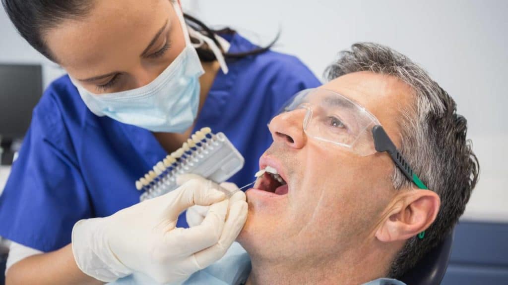 man getting cosmetic dental treatment