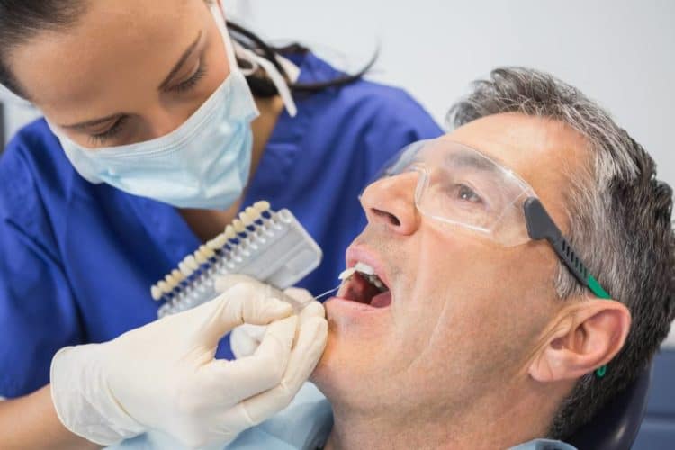 man getting cosmetic dental treatment