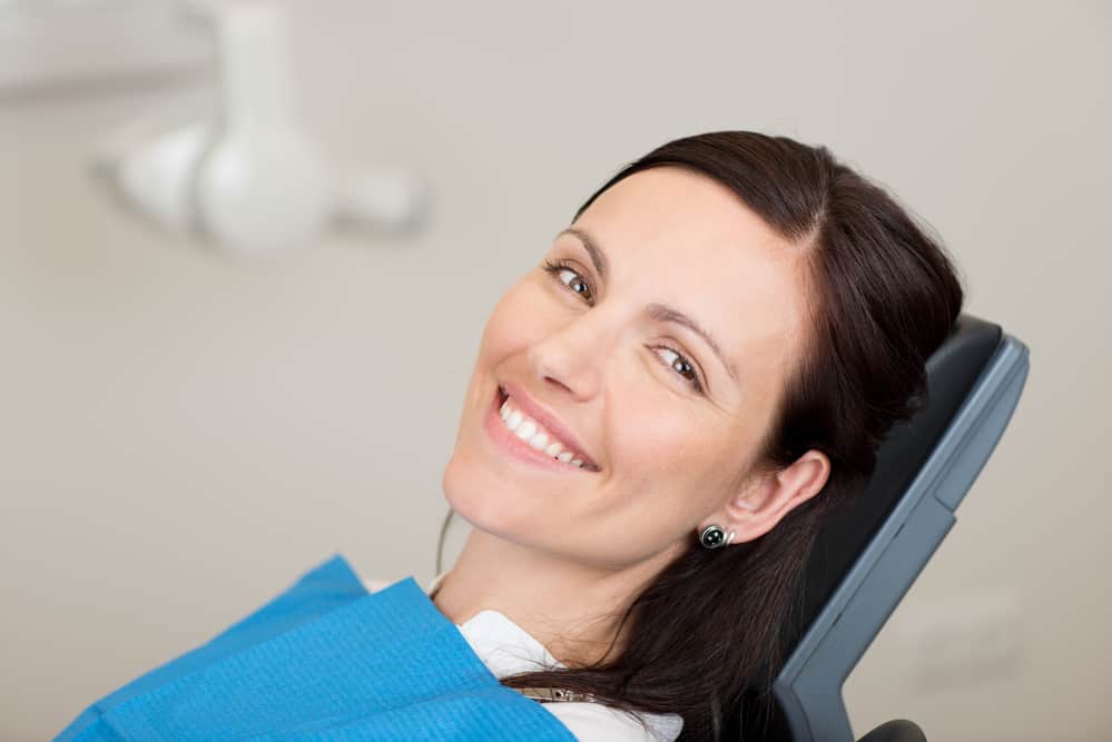 Portrait of mid adult female patient smiling in dentistry